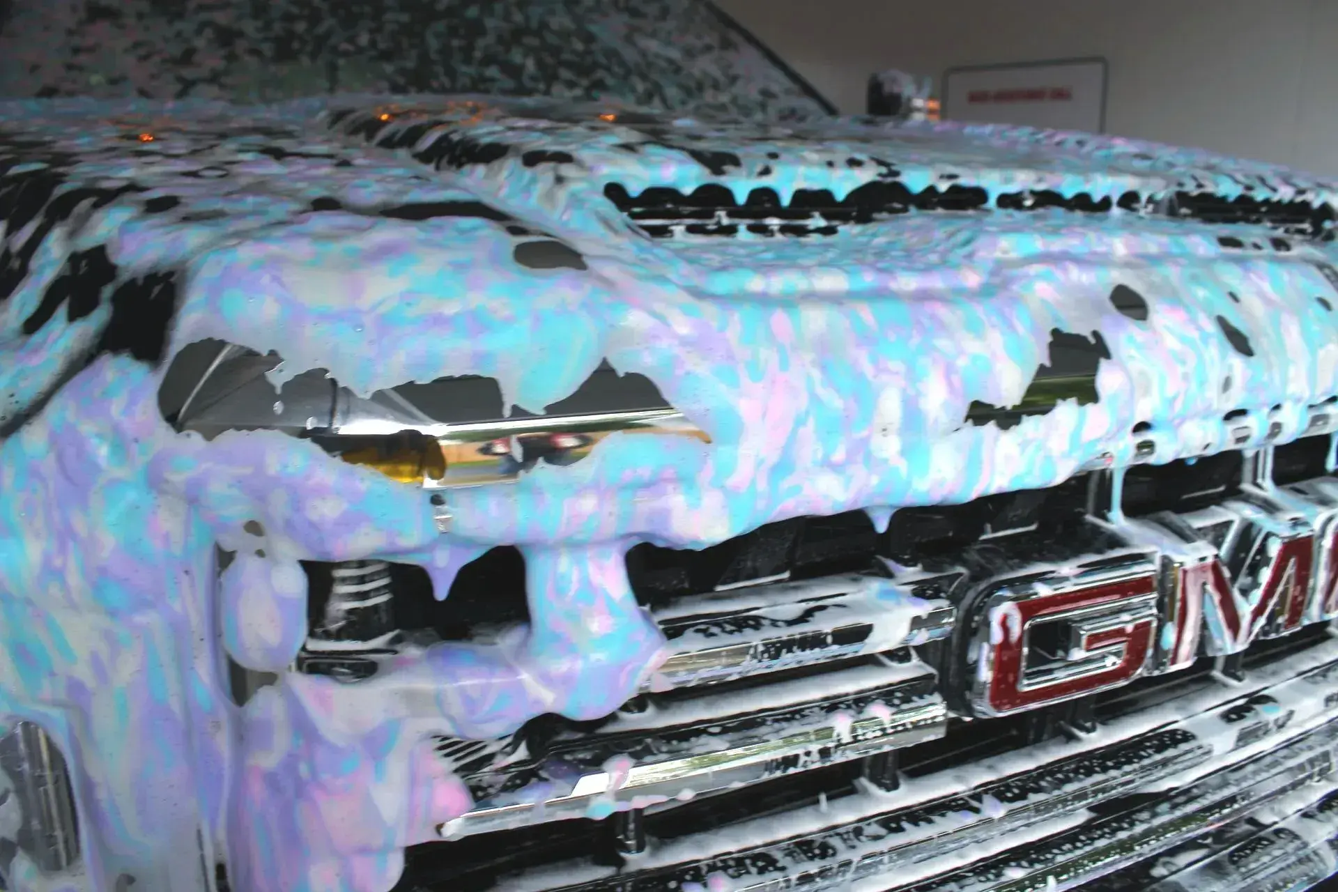 Tri-foam low pressure delivery system installed in a car wash equipment room.